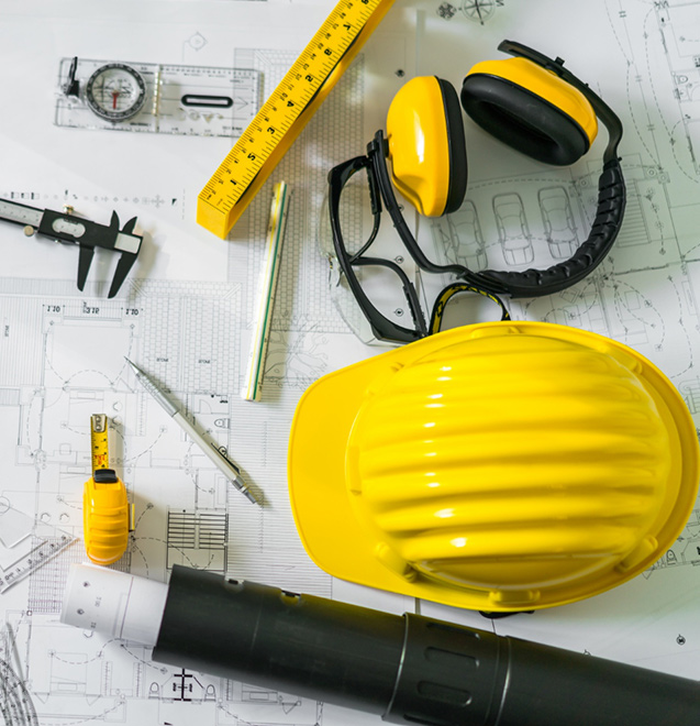 construction-plans-with-helmet-drawing-tools-blueprints